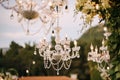 Crystal chandeliers with candles. Glass pendants in the form of balls. Decorating a wedding dinner with antique Royalty Free Stock Photo