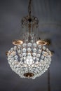 Crystal chrystal chandelier hanging from a ceiling Royalty Free Stock Photo