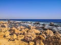 Crystal clear azure water with white beach, stones and palms - paradise coastline coastline of Hurghada, Red Sea, Egypt Royalty Free Stock Photo