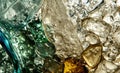 Crystal clear beauty: close-up of sparkling water bubbles and ice cubes backlit in different colors