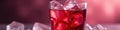 Crystal clear glass filled with a ruby red, ice cold drink , image, ice cubes, pure Royalty Free Stock Photo