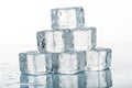 Crystal clear ice blocks stacked on mirror surface Royalty Free Stock Photo