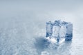 Crystal clear ice cube on grey background, closeup. Space for text Royalty Free Stock Photo