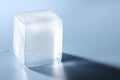 Crystal clear ice cube on light blue background, closeup Royalty Free Stock Photo