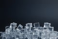 Crystal clear ice cubes with water drops against background. Space for text Royalty Free Stock Photo