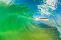 Crystal clear inside out view of a barreling wave