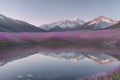 The lake reflects a pastel sky bathed in soft pinks and sapphires.