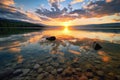 crystal clear lake with sunset and clouds in the background
