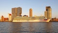 The crystal clear morning overshines the skyscrappers and the moored cruise liner in Rotterdam, Netherlands