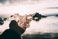 Piece of holding in hand in the Glacier lagoon, Iceland Jokulsarlon, iceberg Royalty Free Stock Photo