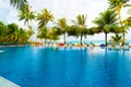 Private oceanfront pool with submerged loungers in a luxury reso