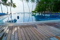 Private oceanfront pool with submerged loungers in a luxury reso