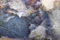 Crystal clear river water rapids flowing over a Cobble Stone and pebbles Royalty Free Stock Photo