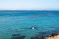 Crystal clear sea water in small rocky bay near Fig tree beach in Protaras, Cyprus Royalty Free Stock Photo