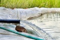 crystal clear sweet and healthy water being flush out. Water is flowing from water pump