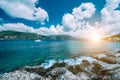 Crystal clear transparent blue turquoise teal Mediterranean sea water in Fiskardo town. White yacht in open sea at Royalty Free Stock Photo