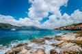 White yacht drift in middle of open crystal clear emerald green sea water near Fiskardo town. Ithaki Island in Royalty Free Stock Photo