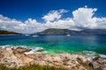 Crystal clear transparent blue turquoise teal Mediterranean sea water in Fiskardo town. White yacht in open sea at Royalty Free Stock Photo