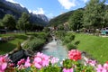The crystal clear waters of the stream that flows into the lake and crosses the beautiful alpine town of Molveno, Trentino Royalty Free Stock Photo