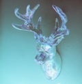 Crystal Deer head on wall. Neon holographic colors. 3D glitch effect Concept minimal photo
