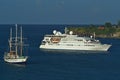 Crystal Esprit cruise ship anchored out with schooner Sagitta Royalty Free Stock Photo