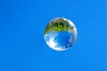crystal glass globe on a blue sky Royalty Free Stock Photo