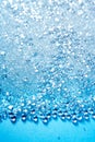 Crystal glass pearls little balls texture on blue Royalty Free Stock Photo