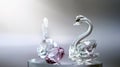 Crystal glass swans with a pink diamond