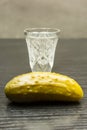 A crystal glass with vodka and pickled cucumber. Royalty Free Stock Photo