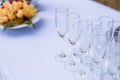 Crystal glasses of champagne on the wedding Reception table. Table setting for an event party or wedding reception at the beach.