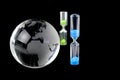 Crystal globe and hourglass on black background Royalty Free Stock Photo