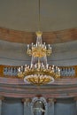 Crystal and golden chandelier in a fancy palace ballroom