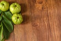 Crystal Guava fruit with leaves isolated on the wooden background Royalty Free Stock Photo