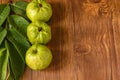 Crystal Guava fruit with leaves isolated on the wooden background Royalty Free Stock Photo