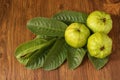 Crystal Guava fruit with leaves isolated on the wooden background Royalty Free Stock Photo