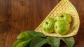 Crystal Guava fruit with leaves isolated on the wooden background Royalty Free Stock Photo