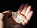 Crystal Healer holding clear quartz