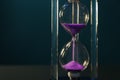 Crystal hourglass on color background. Time management concept