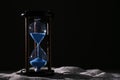 Crystal hourglass on dark background. Time management concept