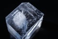 Crystal ice cubes reflection on black background. Close up natural ice block on dark backdrop Royalty Free Stock Photo