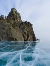 Crystal ice of lake Baikal and a rock