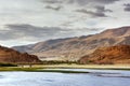 Crystal lake surrounded by green montains