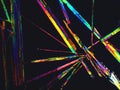 Crystal layer on microscope object glass, seen in polarized light. This causes random unforeseeable color effects