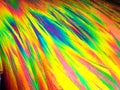 Crystal layer on microscope object glass, seen in polarized light. This causes random unforeseeable color effects Royalty Free Stock Photo