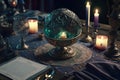 Crystal magic ball and burning candles on wooden table at night. Fortune telling and reading future. Astrology horoscope