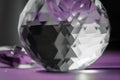Crystal prism refracting light, magic crystals and pyramid, sphere and cube on purple background. Spiritual healing