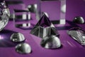 Crystal prism refracting light, magic crystals and pyramid, sphere and cube on purple background. Spiritual healing Royalty Free Stock Photo