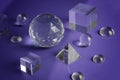 Crystal prism refracting light, magic crystals and pyramid, sphere and cube on purple background. Spiritual healing Royalty Free Stock Photo