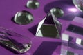 Crystal prism refracting light, magic crystals and pyramid, sphere and cube on purple background. Spiritual healing