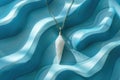Crystal quartz pendant on swirling blue pattern background